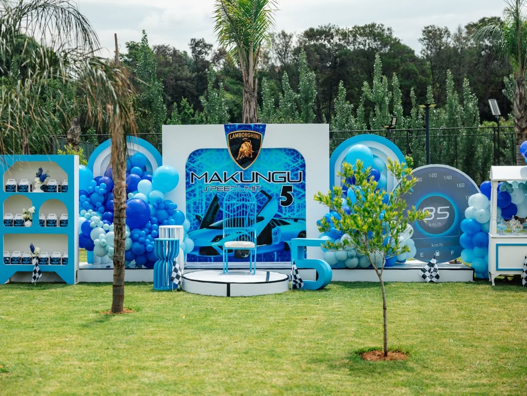 Blue confirmation day setup with balloon installation and custom backdrop